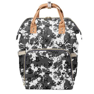 China Water Resistant Black Cow Branded Personalized Diaper Backpack Western Mum Bag Customized Maternity Diaper Bag With Insulated Pockets for sale