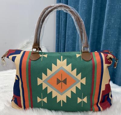 China Lady Saddle Blanket Purse Weekender Unique Western Geometric Bag Fashion Aztec Conchos Boho Overnight Bag For Girls for sale