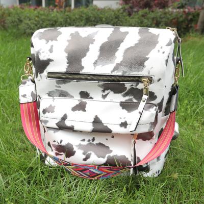 China Wholesale Waterproof Cowhide Print Women Vintage Boho Backpack Purse With Guitar Strap Lady PU Leather Convertible Shoulder Bag For Girls for sale