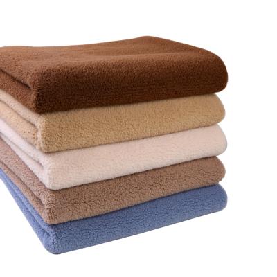 China Wholesale Knitted Soft Plush Brushed Fleece Faux Fur Polyester Fabric Flame Retardant For Slippers Scarves Hats for sale