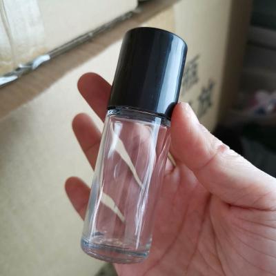 China 1oz 50ml Cosmetic Massage Oil Bottle Rollball Essential Oil Glass Bottle for sale