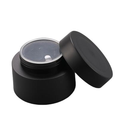 China 30g cosmetic empty container for face cream frosted black plastic cosmetic jar for sale