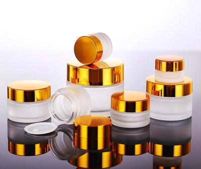 China 60g Cosmetic Cosmetic Containers Frosted Cream Glass Jar With Gold Lid for sale