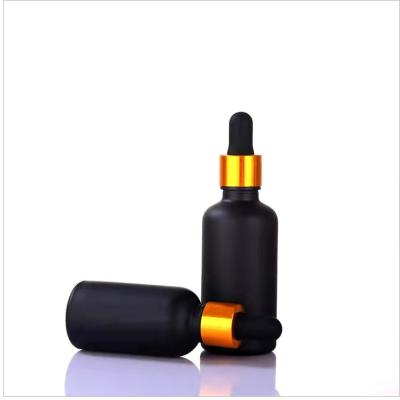 China 50ml 100ml cosmetic frosted black dropper bottle matte black essence glass bottle cosmetic bottle for sale