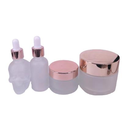 China Stocked Cosmetic Bottle Luxury 30ml 30g 100g Set Skin Care Packaging Frosted Clear Glass Cosmetic Container Cream Jar for sale