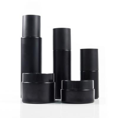 China 30ml 60ml 100ml Black Cosmetic Cosmetics Spray Pump Lotion Bottle 30g 50g Skin Care Cream Bottle With Black Cover for sale