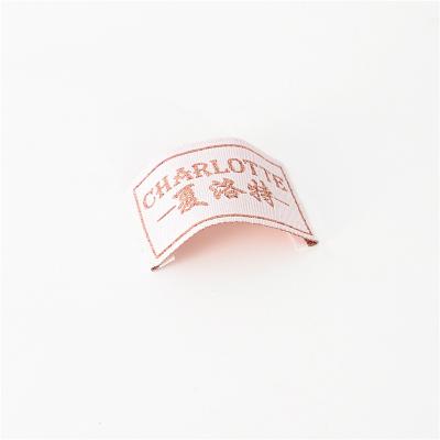 China Customized Washable Shiny Pink Twice Gold Label Brocade Silk Garment Woven Label for sale