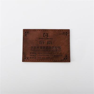 China Custom Label PU Label Garment Decoration Pattern Washable Leather Embossing Leather Embossed Leather Patch for sale