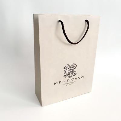 China Recycled Materials Wholesale Luxury Ivory Packaging Logo Beige Gift Paper Bags Custom Made With Handle for sale