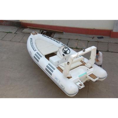 China Eco-friendly custom inflated folding boat PVC inflatable fishing kayak set with rudder for water sport for sale