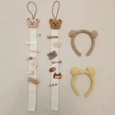 China Cute Korean Cute Bear Hair Hanging Holder Bow Hair Clips Hanger Headband Storage Organizer For Babies Room Decoration for sale