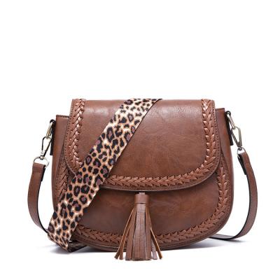 China Other Hot Sale Amazon Women Vegan PU Leather Woven Tassel Cross - Body Bag Saddle Callista Tassel Message Bag With Leopard Strap Handbags for sale