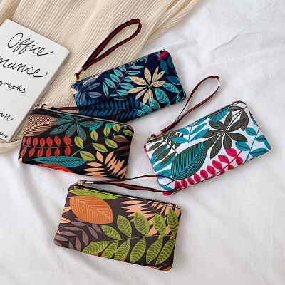 China New Wholesale Anti-theft Summer Cell Phone Bag Foil Printing Oxford Cloth Coin Purse Women Long Grab Pocket Bag Girl Wallet for sale