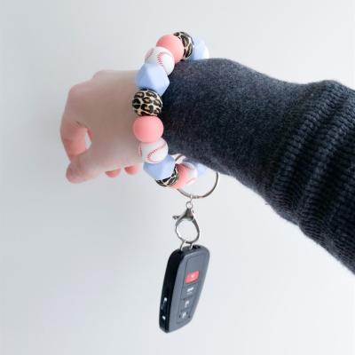 China Fashion Personalized Leopard Print Silicone Wristband Beaded Wristband Key Chain For Women Sports Baseball Beads Car Key Elastic Ring Pendant for sale