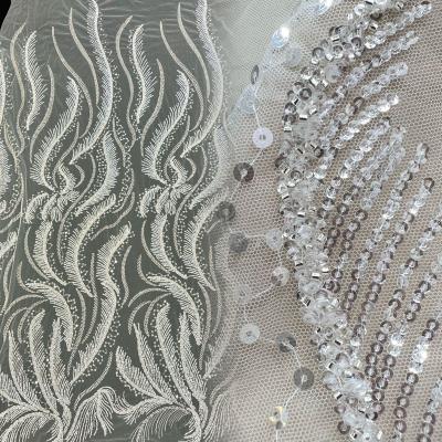 China Viable Turkish White Bridal Fabric Crystal Sequin And Silver Beaded Lace Fabric For OEM Custom for sale