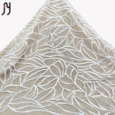 China Viable Fabric 2022 African Nigerian French White Mesh Sequins Embroidery Sequins Net Crystal Lace Fabric For Bridal Dress for sale