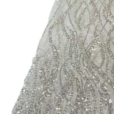 China Handmade Heavy Luxury White Beaded Sequin Crystal Embroidery Bridal Wedding Lace Fabric for sale