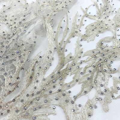 China Viable Wholesale African Embroidered Lace Fabric With Beads Gold French Net Tulle Lace For Asoebi Party for sale