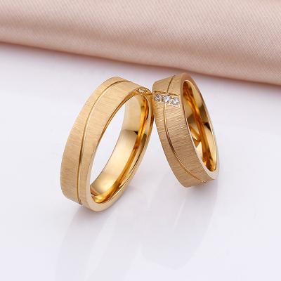 China Fast Delivery Most Sold Product Crystal Diamond Gold Engagement Wedding Ring Stainless Steel Rub Couple Ring for sale