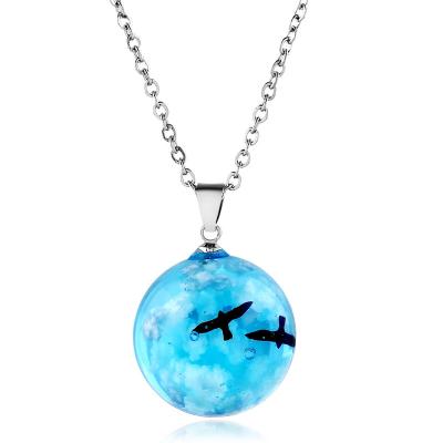 China Fashionable Dreamy Luminous White Cloud Necklace Blue Sky Cartoon Planet Bird Eagle Spherical Resin Sky Cloud Double Pendant for sale