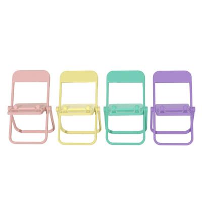 China Adjustable Cute Chair Form Adjustable Foldable Portable Plastic Cell Phone Display Stand Holder for sale