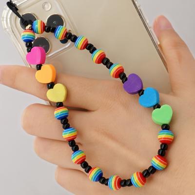 China Environmental friendly female colorful soft pottery beads chain handmade anti-lost yellow smile mobile phone face rice beads cell phone chain for sale