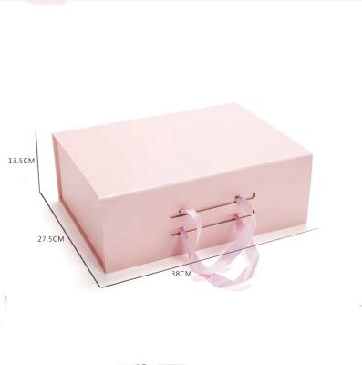 China Custom Logo Luxury Foldable Clothing Packaging Recyclable Boxes With Pink Magnetic Ribbon Closure Gift Box for sale