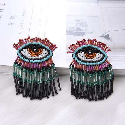 China Bohemian New Rice Bead Earrings Demon Eyes Handwoven Earrings Long CLASSIC Wholesale Tassel Earrings for sale