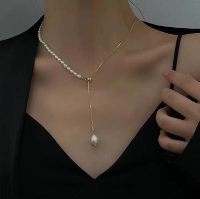 China Wholesale CLASSIC Jewelry 18k Gold Plated Adjustable Freshwater Pearl Pull Necklace Clavicle Chain Necklace for sale