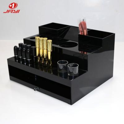 中国 JAYI Factory wholesale custom acrylic cosmetic product display stand 販売のため