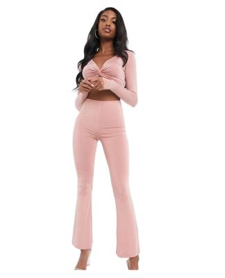 China 2022 Fashion Women Ladies Coordinating Detail QUICK DRY Twist Top Long Sleeve Crop Top And Stealth Rocket Pants Set for sale