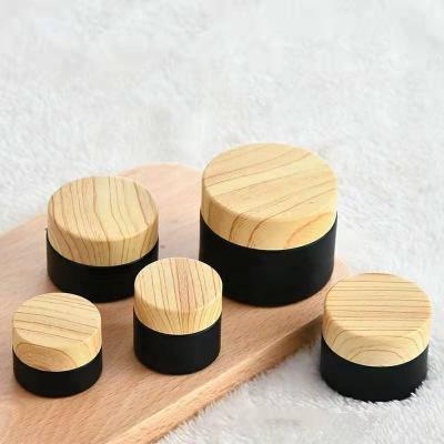 China Unique Design Skin Care Matte Black Cosmetic Jars Face Cream Packaging Bottle Customized Value Added Glass Cosmetic Cream Jars for sale