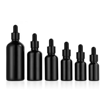 China Eco-friendly Matte Black Cosmetic Essential Oil Dropper Glass Essence Bottles 10ml 30ml 60ml 100ml Black Dropper Bottle for sale