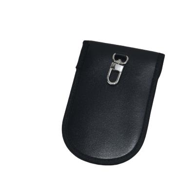 China Minimalist Hot Sale Car Key Signal Blocker Case Punch Bag Leather Material Protector for sale