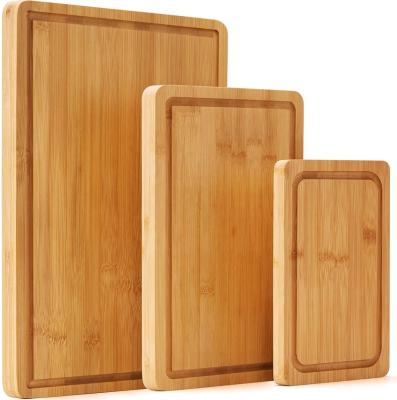 China Sustainable Factory Custom Eco-Friendly 3 Piece Wood Slotted Large Organic Bamboo Cutting Boards Cutting Plates Set for sale