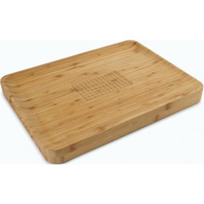 China Sustainable Lower MOQ Premium Angled Outdoor Bamboo Cutting Board Butcher Block With Center Food Handle for sale