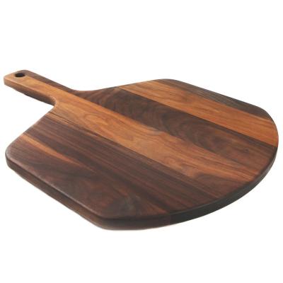 China Sustainable Premium 22x16'' Large Wooden Walnut Pizza Peel Cutting Saving Board with Handle for sale