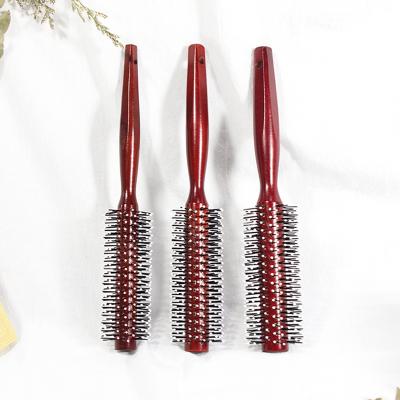 China All Salon Professional Bristle Lotus Teeth Wooden Nylon Loop Comb Hair Comb Round Handle for sale