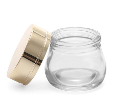 China 120ml Personal Care Empty Clear Glass Facial Jar Cosmetic Cream Jar With Gold Cap Cream Container for sale