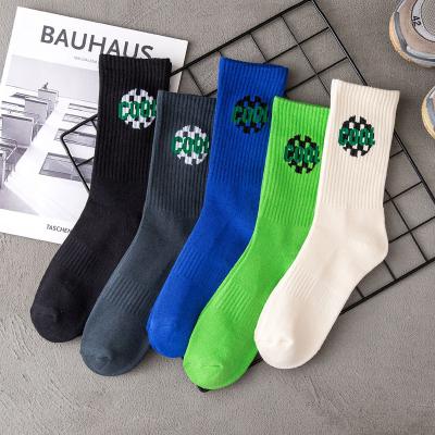 China New cool winter sports knitting tube checkerboard letter mi thickened towel crew socks cotton sports running men's sock for sale