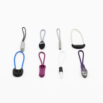 China Customized LOGO OEM ODM Popular design string cord colorful zipper rope slider rubber  puller for garment for sale