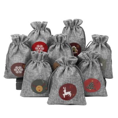 China Canvas Four Color 24 Holiday Christmas Package Pouch Drawstring Candy Gift Canvas Bags for sale