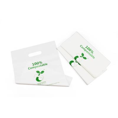 China BIODEGRADABLE PLA 100% Biodegradable Die Cut Handle Shopping Plastic Bags for sale