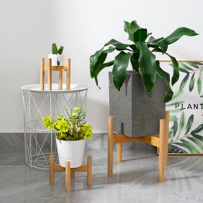 China Modern Wholesale Home Decoration Cement Wood Concrete Flower Pot With Foot Flower Pot for sale