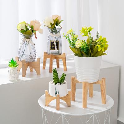 China Home Modern Curved Bamboo Cross Flower Pot Stand for sale