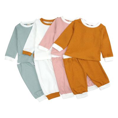 China Anti-wrinkle kids clothing sets 2022 babies clothes spring plain two piece pants sets babies clothing sets for 1year baby for sale