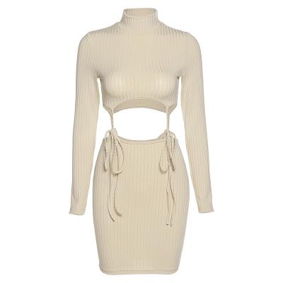 China 2022 Breathable Women Bandage Sling Dress Long Sleeve Hollow Ribbed Elastic Bodycon Sweater Dress Turtle Neck Fashion Casual Outfits for sale