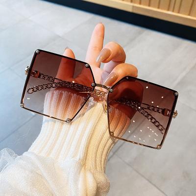 China Hot sale fashion metal chain temples European fashion sunglasses and American fashion large square sunglasses rimless sunglasses for sale