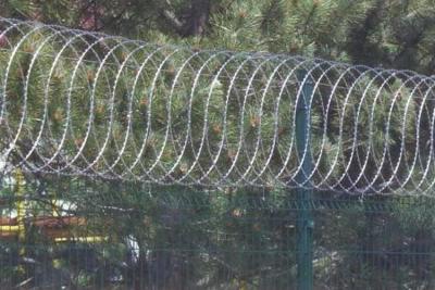 China Kenya Flat Wrap Razor Wire 10 meters Galvanized Security barbed wire for sale