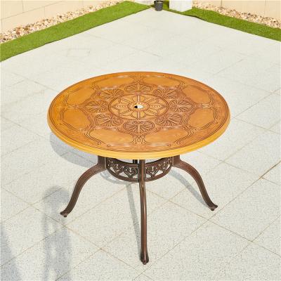 China Dia100cm modern the outdoor round patio furniture outdoor dining table cast aluminum table with wood grain color table top for sale